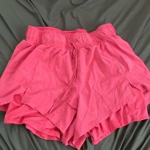 Pink athletic shorts with undershorts